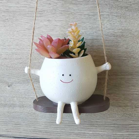 Pequeña maceta en columpio sur cache-pot.fr