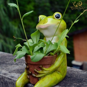 Frog holding a pot - 2